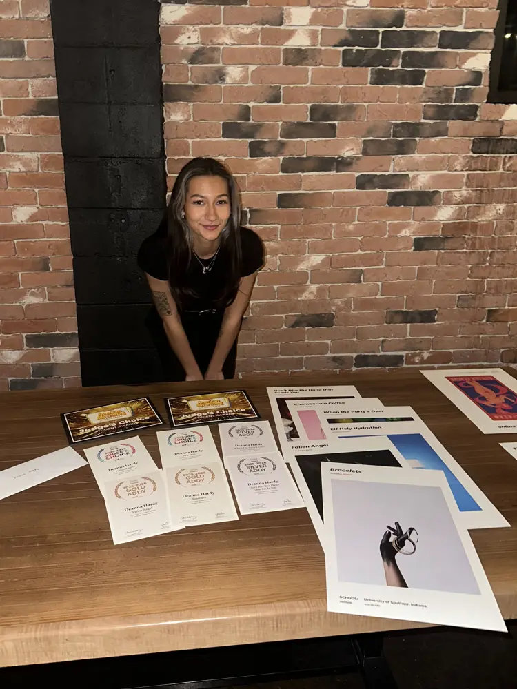 USI public relations and advertising student Deanna Hardy posing with her awards