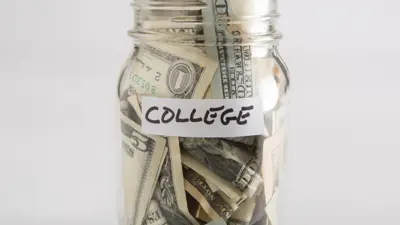 U.S. bills in a ball jar labeled "college"