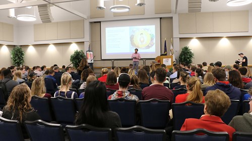 Newman presenting in Carter Hall