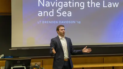 Lt. Brenden Davidson '15 gives his Alumni in Residence presentation, "Navigating the Law and Sea"