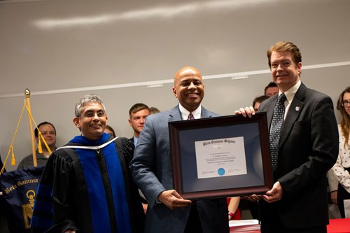Rochon and McGuire holding certificate