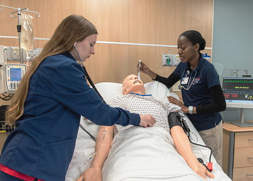 Two nursing students in simulation center