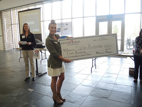 Callen holding her check