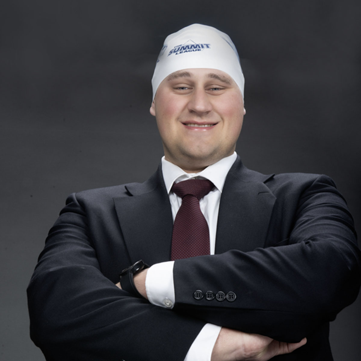 A member of the homecoming court wears a USI swim cap in one of his homecoming photos.