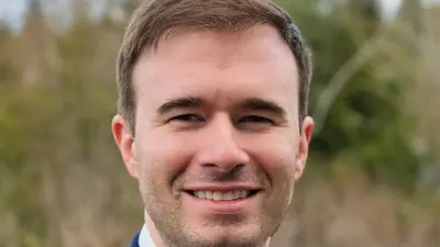 Casual portrait of USI political science graduate Brenden Davidson