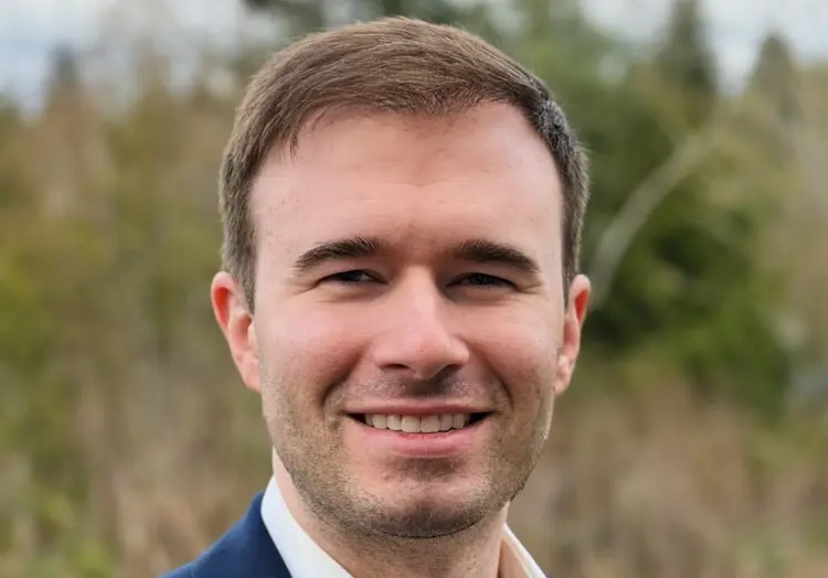 Casual portrait of USI political science graduate Brenden Davidson