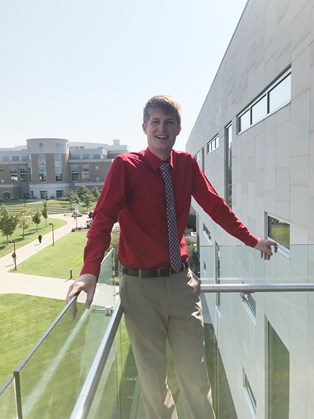 Austin standing on the BEC balcony