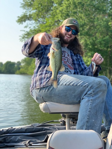 Ezra holding a fish he caught