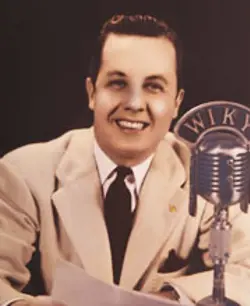 Kenneth Peva McCutchan with WIKY microphone