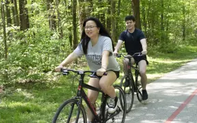 Students enjoy riding bikes on the Burdette Trails. USI's Recreation, Fitness and Wellness Center rents out bikes free to USI students. 
