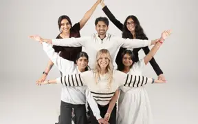 The Executive Committee of the South Asian Student Union strike a fun post in the photo studio.