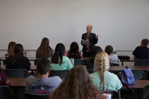 Giles talking to students