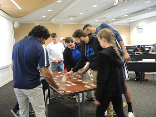 students looking at bills