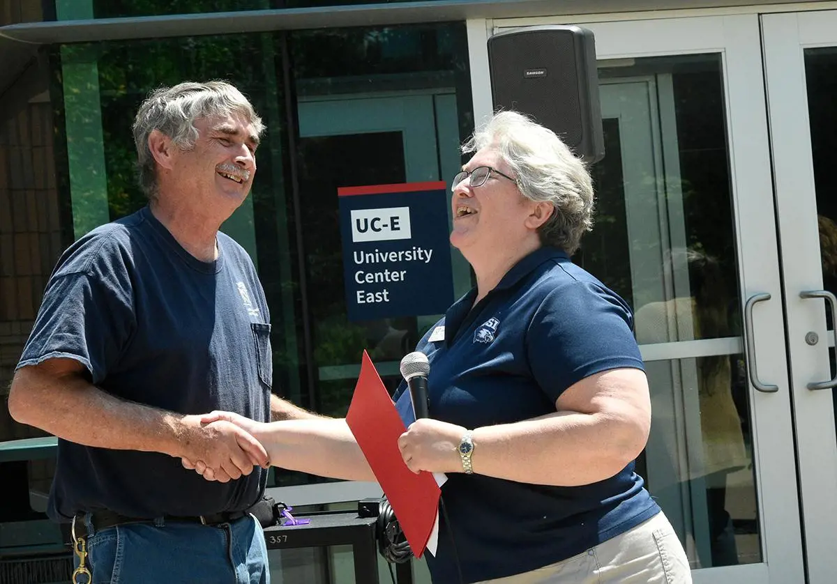 Image of David Dockery outside receiving congratulations