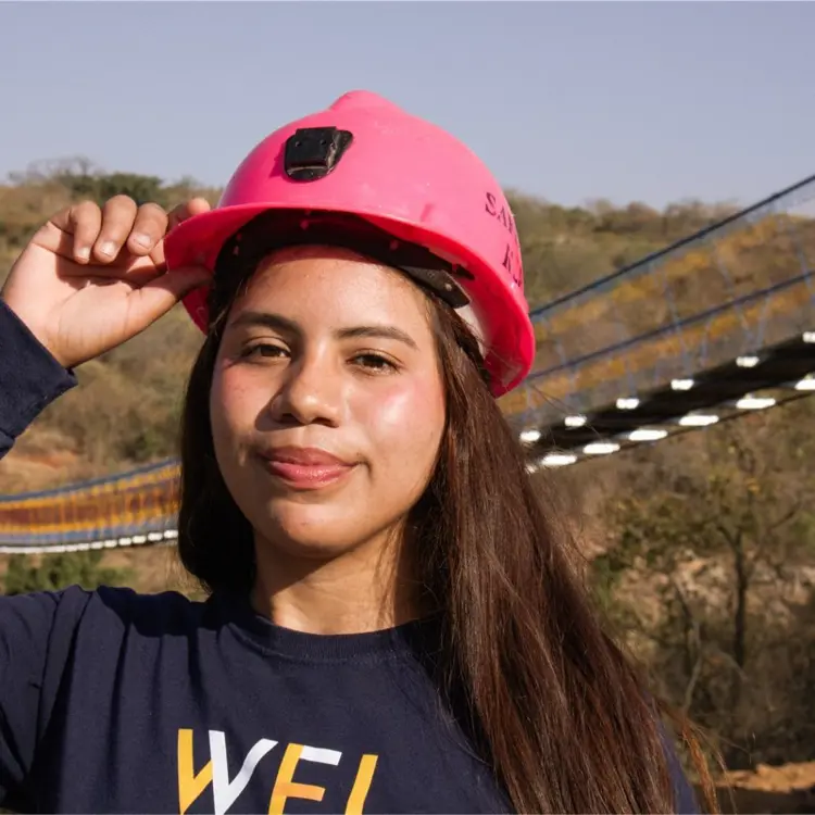 Casual portrait of USI electrical engineering graduate Melanie Cedeno in the field