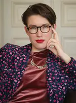 Amie Whittemore standing by a pond in the woods