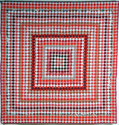 Trip Around the World pattern on multicolored quilt
