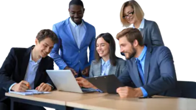 Individuals in professional attire circle around a laptop during a discussion