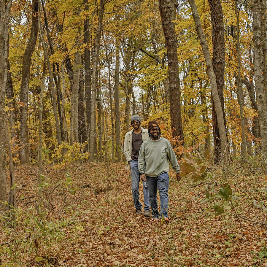 Students admire the fall leaves as they hike up the steep Eicher Trail, part of the South Trail complex.  