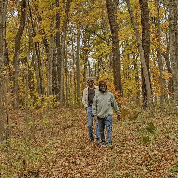Students admire the fall leaves as they hike up the steep Eicher Trail, part of the South Trail complex.  