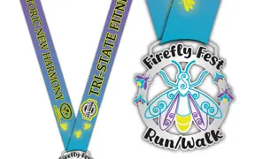 Race medal and ribbon featuring a firefly design and “Firefly Fest Run/Walk” text.