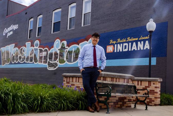 Angel in front of a Washington, Indiana, sign