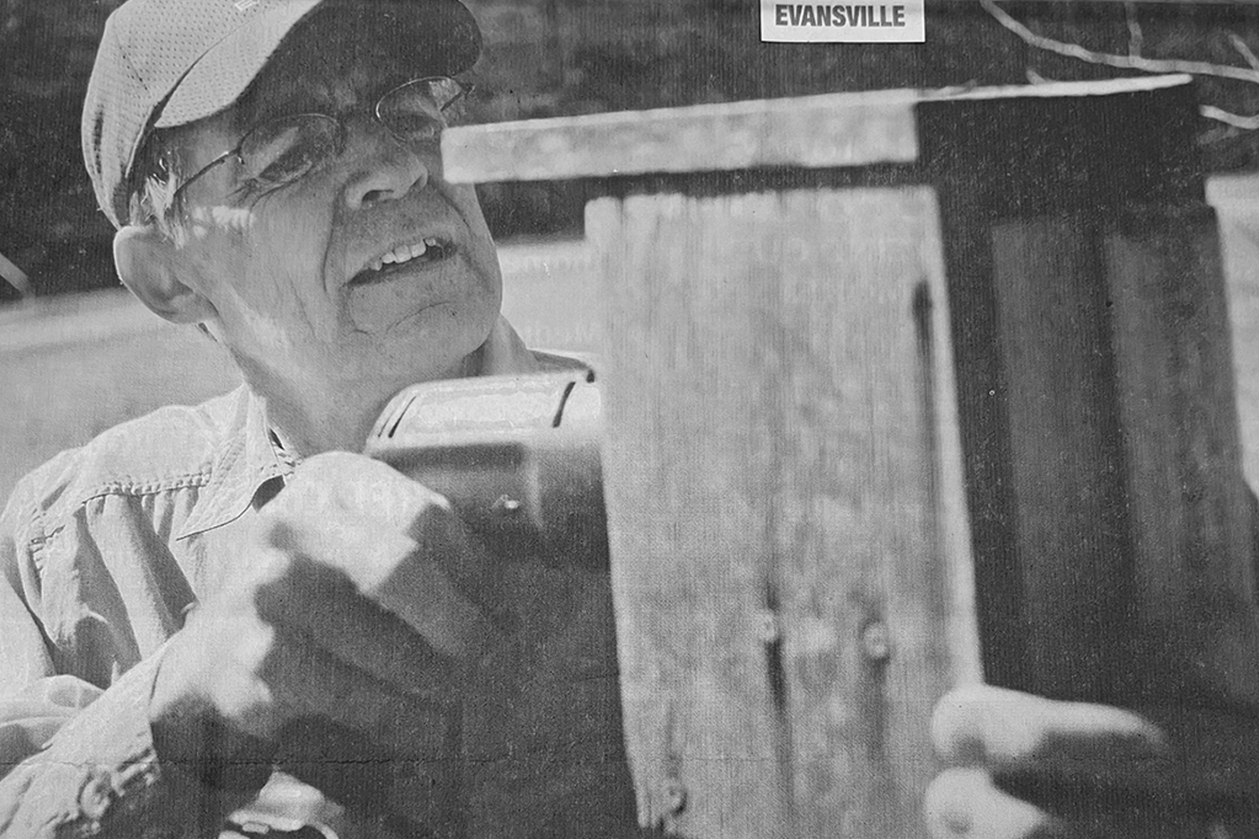 Chuck Price, former education faculty at USI, repairing bluebird boxes on campus.