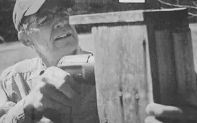 Chuck Price, former education faculty at USI, repairing bluebird boxes on campus.
