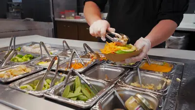 dining hall team member preparing a meal