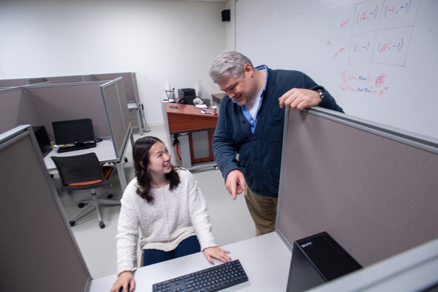 Professor P talking to student
