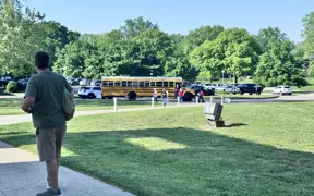 A school bus unloading students at the Atheneum