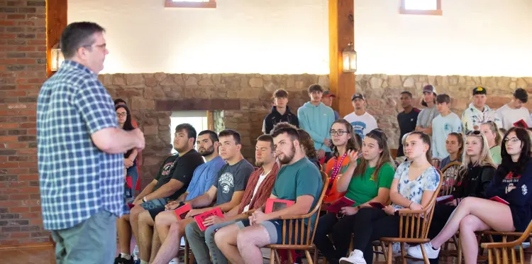 Dr. William Elliott teaches a large UNIV 101 class inside the Granary building in New Harmony