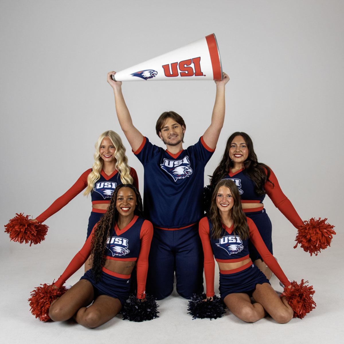 USI's Cheer Team posing for their media day photos. 